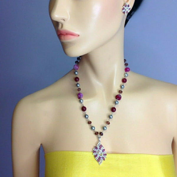 Luminent Shades of Magenta with Zircon Studded Pendant Necklace Set