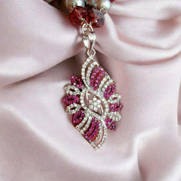 Luminent Shades of Magenta with Zircon Studded Pendant Necklace Set